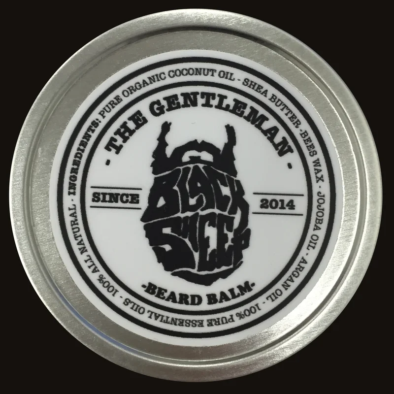 A tin of The Gentleman Black Sheep Beard Balm by New Style Hair Design